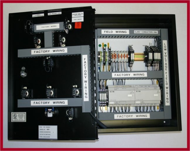 Inside view of SSI EPSMS control cabinet showing shunt trip breakers and logic control wiring for NFPA 70 compliance